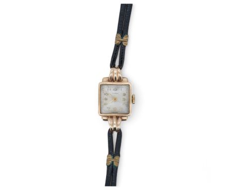 A lady's 9ct gold Primula manual wind wrist watch, with fluted lugs, on a leather strap. Condition - fair