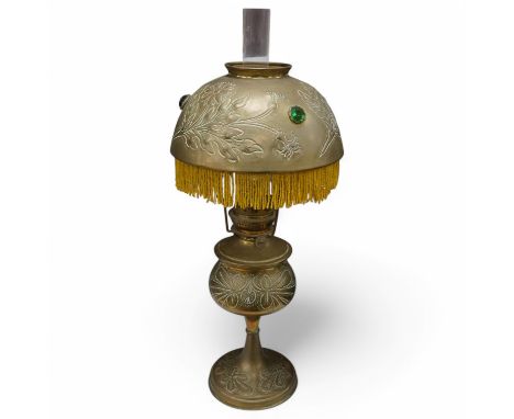An 20th century continental brass oil lamp with decorative beaded fringed shade, 56cm high. Condition - good