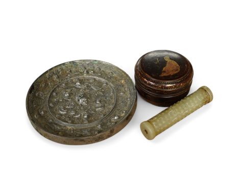 A Chinese silvered bronze mirror, a lacquer box and a jade cylindrical bead, largest 15cm diameter. Condition - fair to good