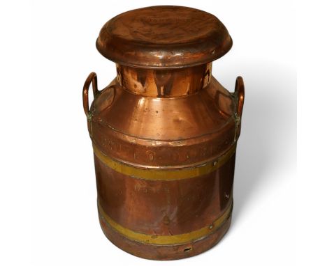 A United Dairies copper and brass banded milk churn, 52cm high. Condition - fair to good