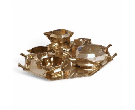 A George VI Art Deco silver five piece tea service with a matching two handled tea tray, by Hamilton &amp; Co, of octagonal f