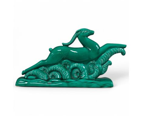 A French Art Deco ceramic antelope with green glaze, 46cm high. Condition - good