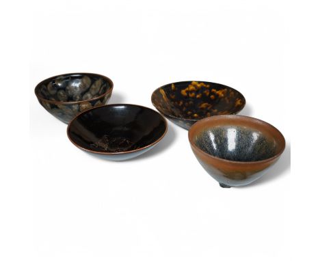 Four Chinese ‘hares fur’ pottery bowls, largest 16cm diameter. Condition - good