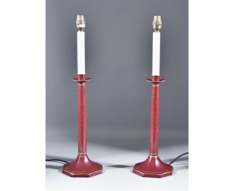 A Pair of Italian Red Toleware Electric Lamps, Modern, of candlestick form, on octagonal bases, 24ins high, with shades for s