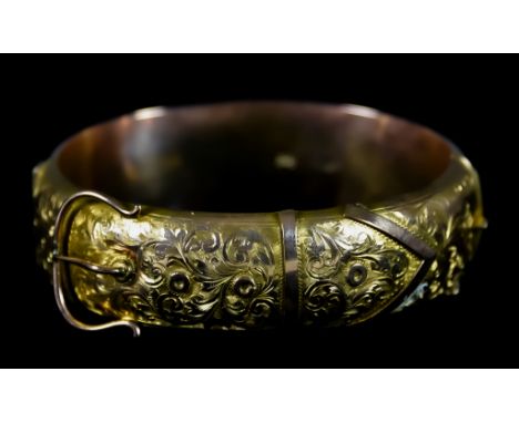 A 9ct Gold Stiff Bangle, in the form of a belt, 215mm x 20mm, gross weight 20gThe bangle shows some denting to the rear (plea