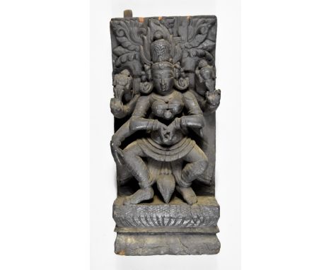 A Carved Teak Hindu Aratha Chariot Panel, 19th Century, depicting Lakshmi, 24ins (61cm) x 10.75ins (27.3cm)