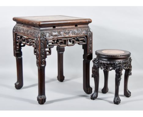 A Chinese Hardwood Square Jardiniere Stand, with pink flecked marble panel to top, carved and fretted apron, on carved square