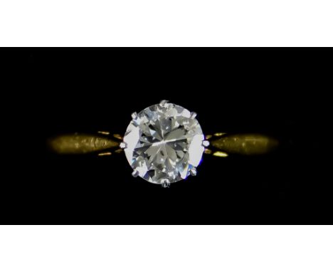 An 18ct Gold and Platinum Solitaire Diamond Ring, Modern, set with a brilliant cut white diamond, approximately .75ct, size M