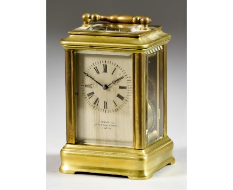 A Late 19th Century Miniature Brass Carriage Clock, retailed by Thornhill, 144 New Bond Street, London, the silvered dial wit