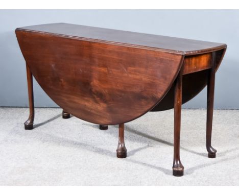 A George III Mahogany Circular Drop Leaf Cottage Dining Table, on turned legs with pad feet, 16ins diameter x 29ins highThe t