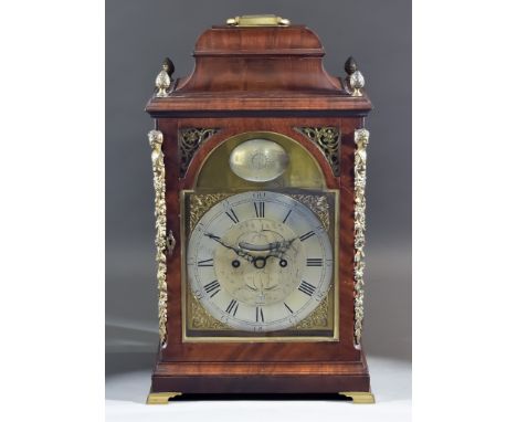 A George III Mahogany Bracket Clock, the 7.75ins arched brass dial with silvered chapter ring with Roman and Arabic numerals,