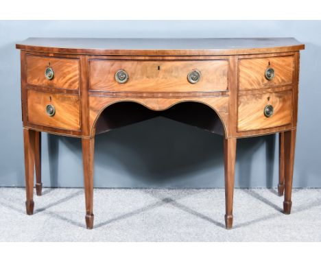 A George III Mahogany Bow Front Sideboard, with cross banded edge to top, fitted one frieze drawer, flanked by cupboards, eac