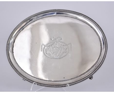 A George III Silver Oval Stand&nbsp;by Elizabeth Jones, London 1783, with bead mounts, engraved with crest and on four shell 
