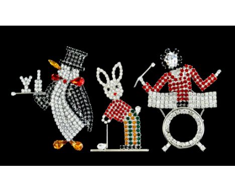 Three Vintage Butler &amp; Wilson Brooches, comprising - a penguin, 620mm x 75mm, a drummer, 60mm x 70mm and a rabbit playing
