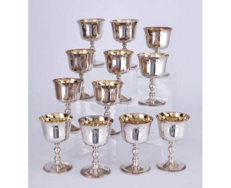 A Set of Twelve Elizabeth II Silver and Silver Gilt Goblets, by Royal Irish Silver Ltd., London 1968, the plain bowls with kn