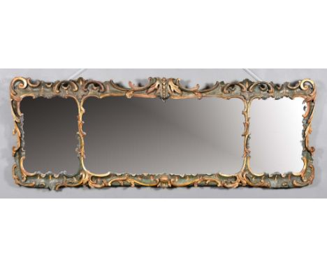 A 19th Century Ebonised and Gilt Framed Rectangular Wall Mirror of "Rococo" Design, with sea scroll and leaf carved frame, in