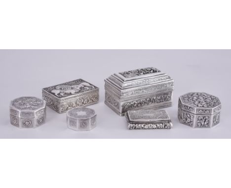Two Chinese Silvery Metal Octagonal Boxes and Covers, and Four Other Boxes, the Chinese boxes each chased and embossed with v