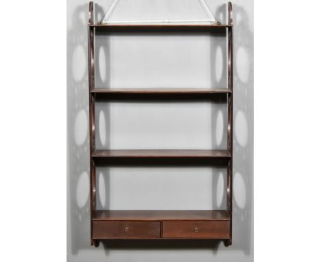 A Mahogany Four Tier Hanging Wall Shelf of 18th Century Design, with shaped and fretted end supports and fitted two drawers t