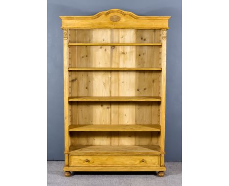 A Late 19th Century French Pine Dwarf Bookcase, with moulded edge to top, the frieze carved with stylised flowers, fitted fou