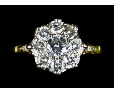 A Diamond Flower Head Ring, set with nine old European cut diamonds, approximately 1ct total, size L, gross weight 2.8g Note: