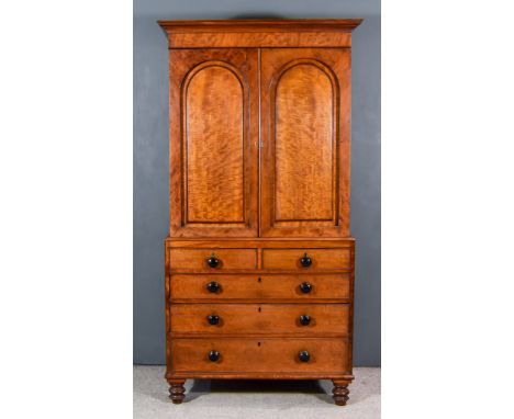 An Early Victorian Figured Mahogany Gentleman's Wardrobe, with moulded cornice, plain frieze, fitted two shelves enclosed by 