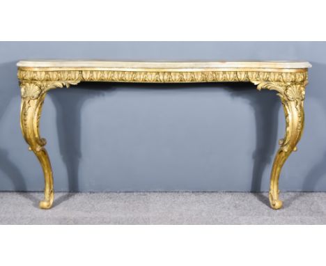 A 19th Century Italian Gilt Serpentine Fronted Console Table, with white marble top, leaf carved frieze, on bold shell capped