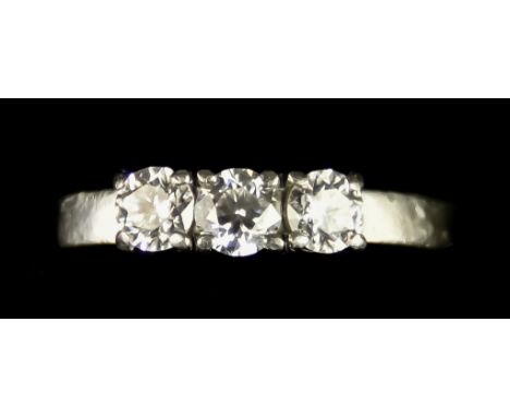 A Platinum Three Stone Diamond Ring, set with three brilliant cut white diamonds, approximately .75ct total, size L, gross we