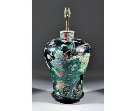 A Chinese Famille Noire Porcelain Baluster-Shaped Vase, enamelled with rockwork and flowering branches, now converted to a la