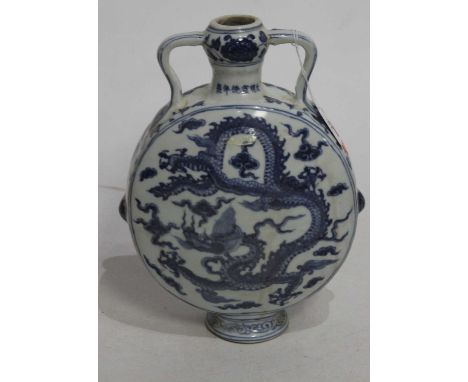 A Chinese export blue and white moon flask, having twin handles and decorated with a dragon chasing a pearl, h.28cm