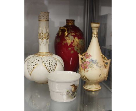 A Royal Crown Derby vase, of ovoid form, on a red ground with raised floral decoration and twin gilt handles, printed Royal C