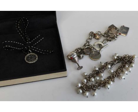 Links of London silver medallion on ribbon and in original box, together with a Links of London silver charm bracelet, 38.5g,