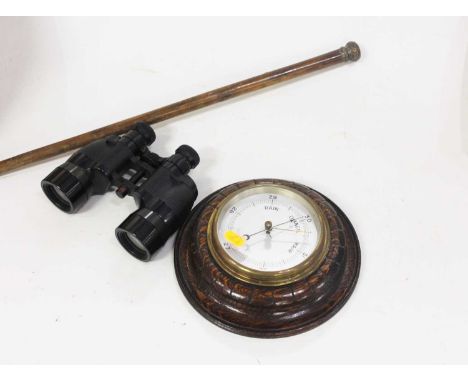 A 20th century oak cased aneroid wall barometer, dia 21cm, together with a pair of binoculars and a walking stick