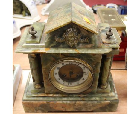 A 19th century onyx mantel clock, of architectural form, having eight-day movement, the enamel chapter ring showing Arabic nu
