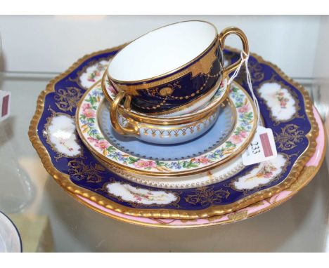 A Victorian Derby dessert plate, on a pink ground with raised gilt floral decoration, having printed crown mark verso; togeth