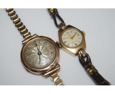 A ladies 9 carat gold cased wristwatch, having an engine turned dial with Arabic numerals and 15 jewel movement, on a gilt me