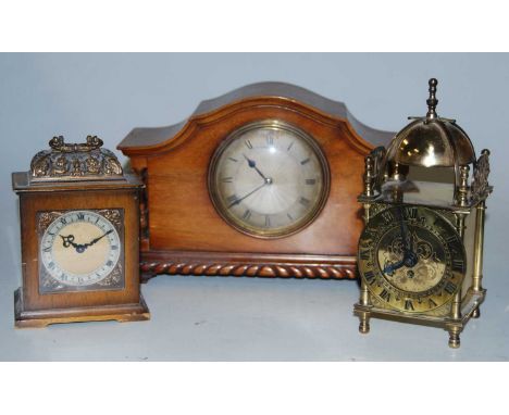 A 1920s walnut cased mantel clock having an engine turned silvered dial with Roman numerals signed Munsey &amp; Co. Ltd., Cam