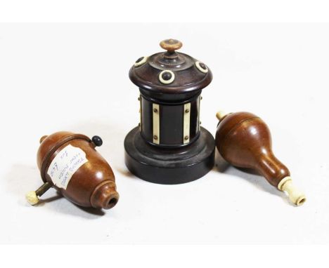 An early 20th century treen bobbin jar, having removable cover, h.9cm; together with two treen light switches (3)Condition re