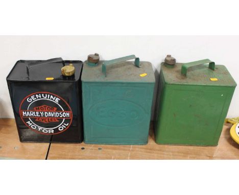 A collection of various petrol cans to include a reproduction Harley Davidson example, an original overpainted Esso, and an u