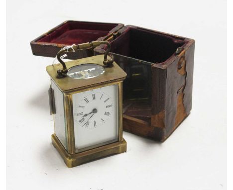 An early 20th century lacquered brass cased carriage clock, having enamelled dial with Roman numerals, visible platform lever