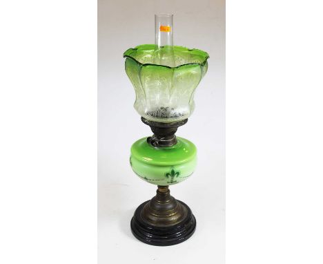 An early 20th century green tinted glass oil, lamp, with acid etched glass shade, 56cm high
