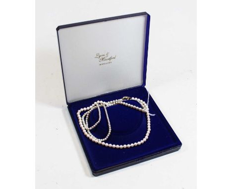 Two pearl necklaces, each with 9ct clasps