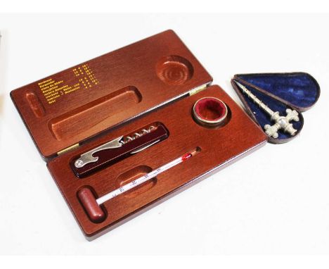 A late 19th century French steel champagne tap in fitted case, and a modern cased corkscrew set with thermometer (2)