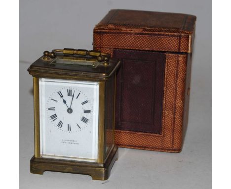 An early 20th century lacquered brass cased carriage clock having an enamel dial with Roman numerals with visible platform le