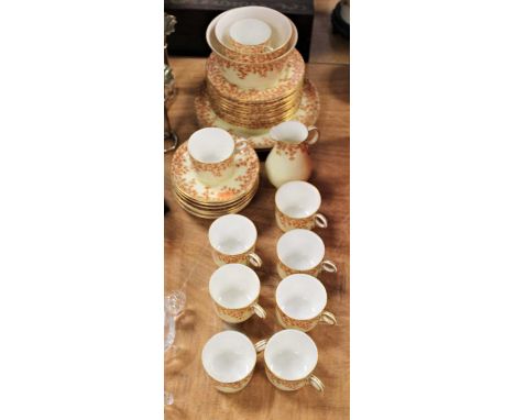 A Victorian Royal Worcester part tea service (eight place setting - incomplete), on a cream ground with red floral decoration