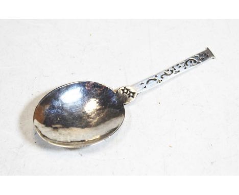 An Arts & Crafts style silver caddy spoon having a hammered bowl and engraved stemCondition report: Some light surface scratc