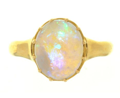 A CABOCHON OPAL RING, IN GOLD MARKED 18CT, 2.5G, SIZE N++LIGHT WEAR CONSISTENT WITH AGE 