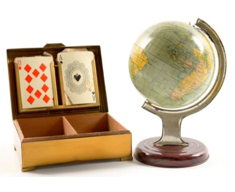 A LITHOGRAPHED TINPLATE 5" TERRESTRIAL GLOBE ON STAND AND A BRASS AND BLACK ENAMEL PLAYING CARD BOX, BOTH C1930