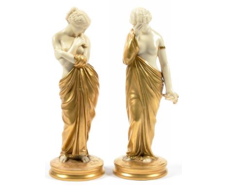 A PAIR OF ROYAL WORCESTER OLD IVORY AND GILT FIGURES OF JOY AND SORROW, 24CM H, PUCE PRINTED MARK, C1900