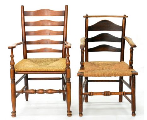 A VICTORIAN ASH LADDER BACK RUSH SEATED ELBOW CHAIR AND ANOTHER, SIMILAR 