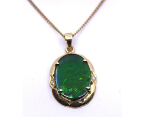 14ct Yellow Gold Opal Triplet Pendant and 9ct Yellow Gold Curb Link Fine Chain. The Oval Opal Triplet pendant measures approx